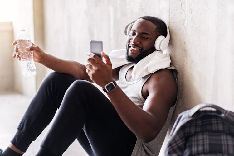 Cheerful handsome african sportsman in process of recreation